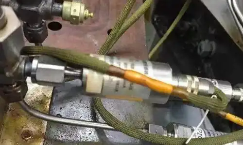 How can pressure sensors be protected from overpressure surges?